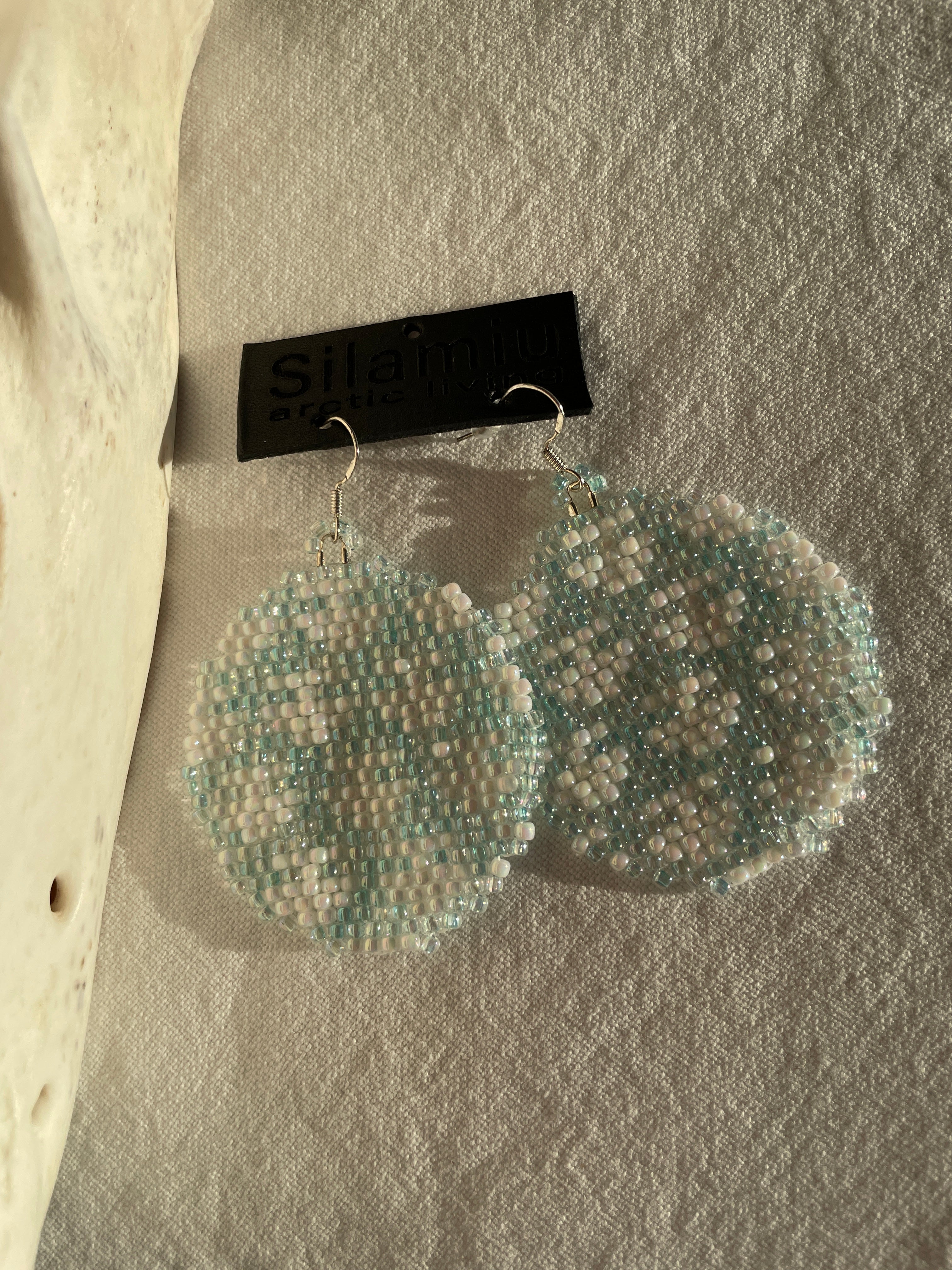 Ulo, the female planet - iceblue and white