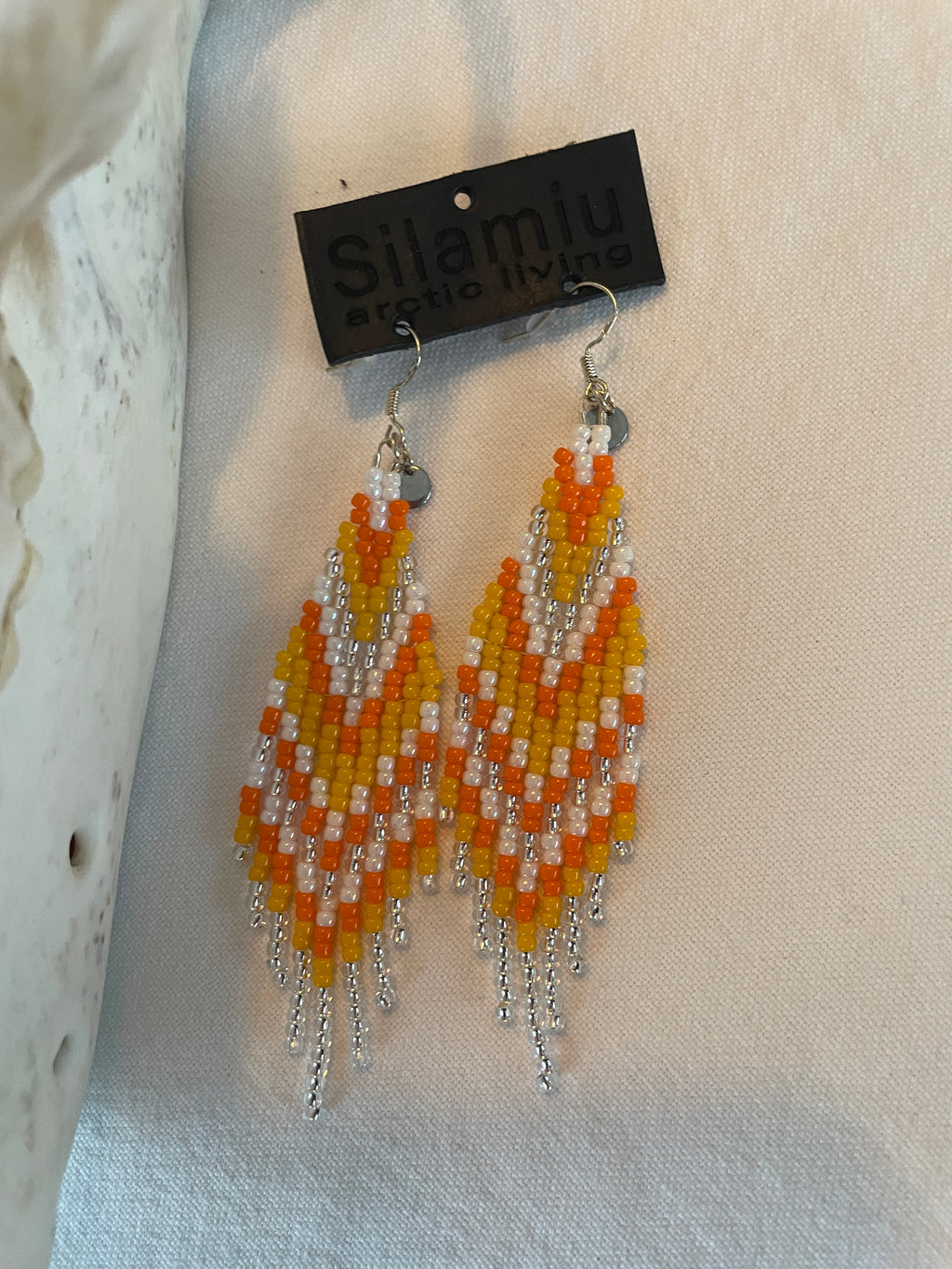 Arctic Feather Fringes, silver and orange.