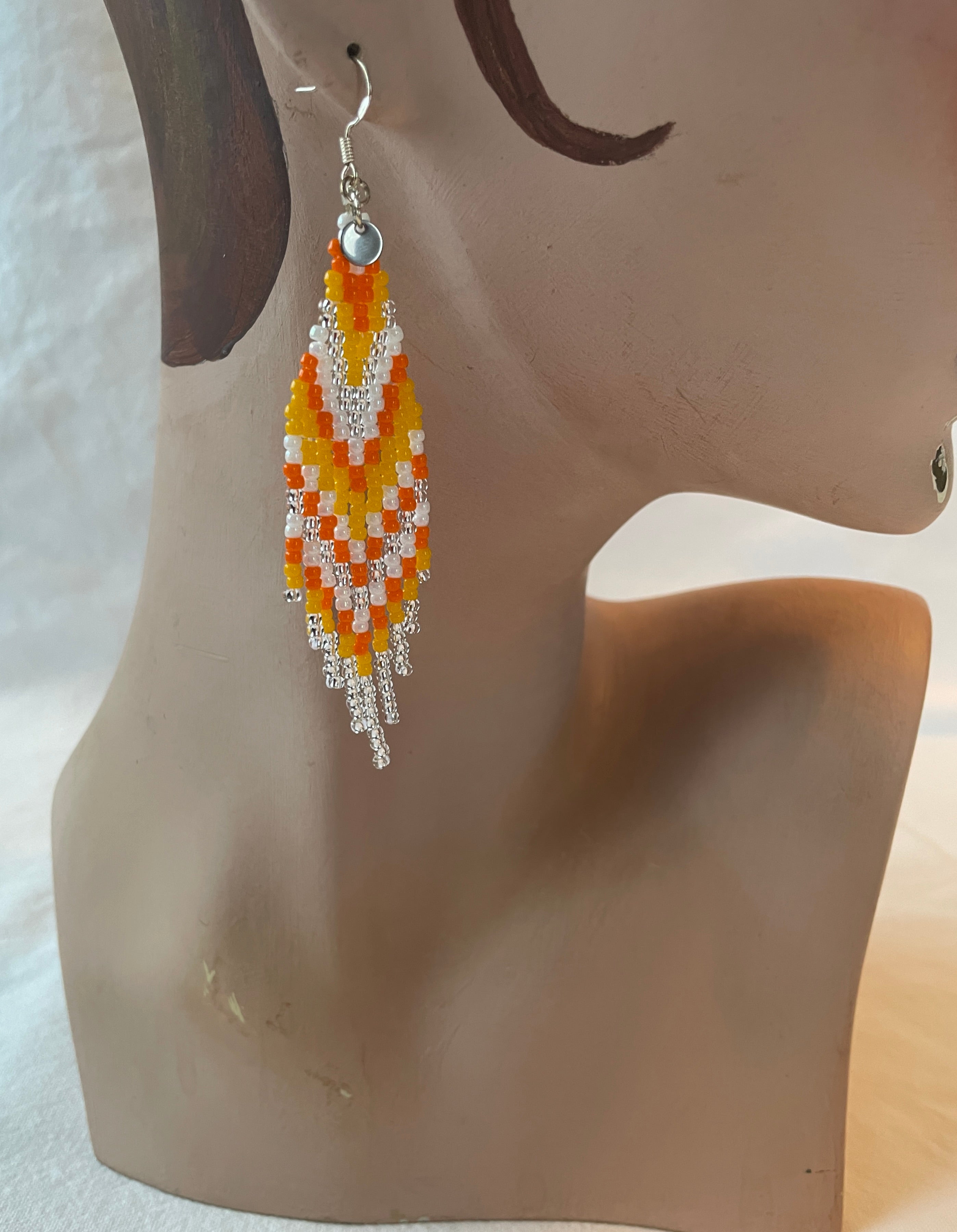 Arctic Feather Fringes, silver and orange.
